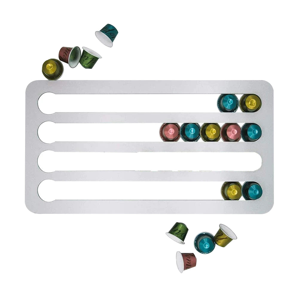 Metallic white holder with colorful coffee capsules on a white background
