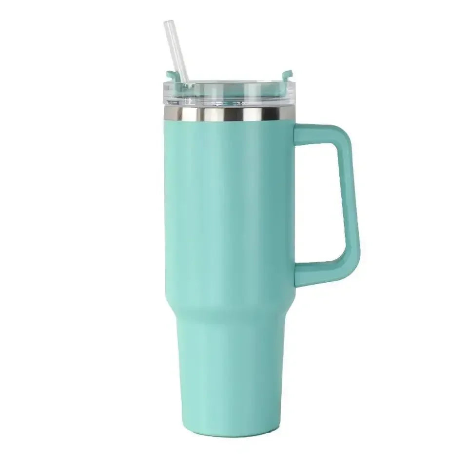 tumbler with handle and straw lid, surrounded on a white background
