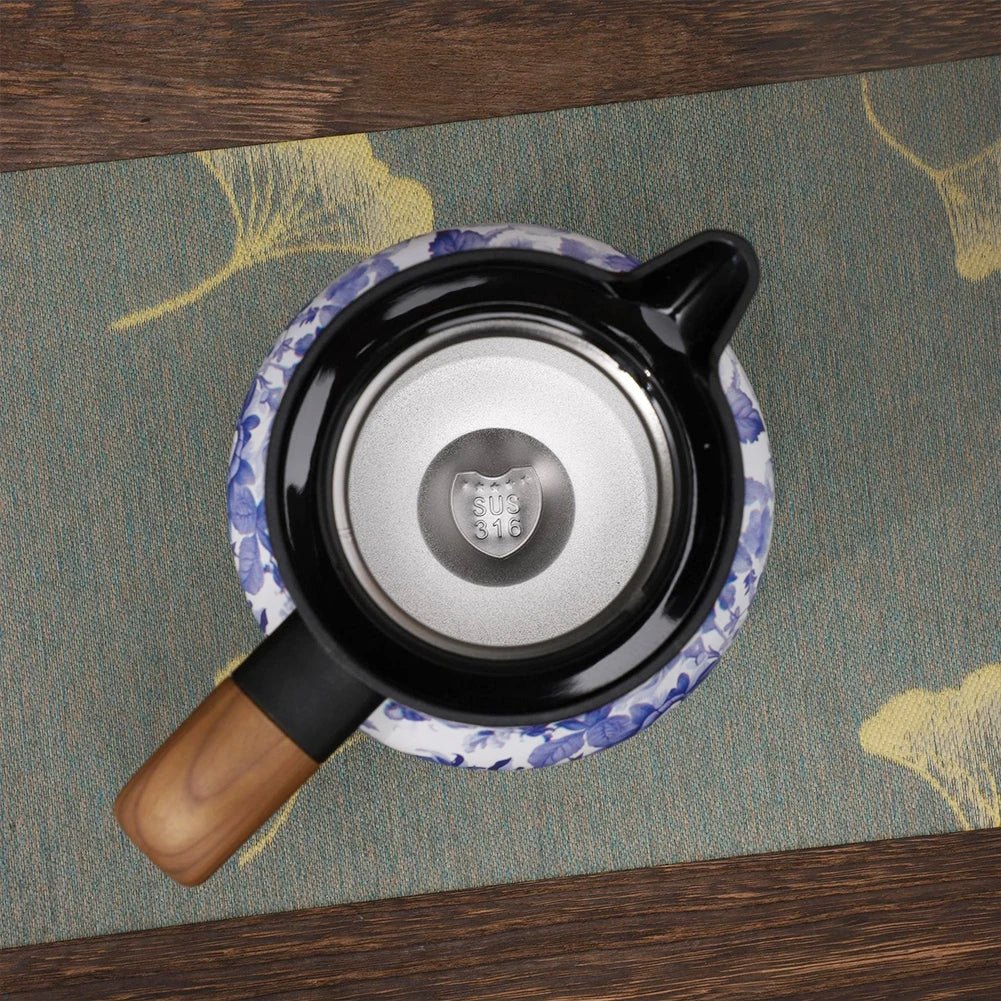 Thermal Coffee Carafe with wooden handle on a floral placemat