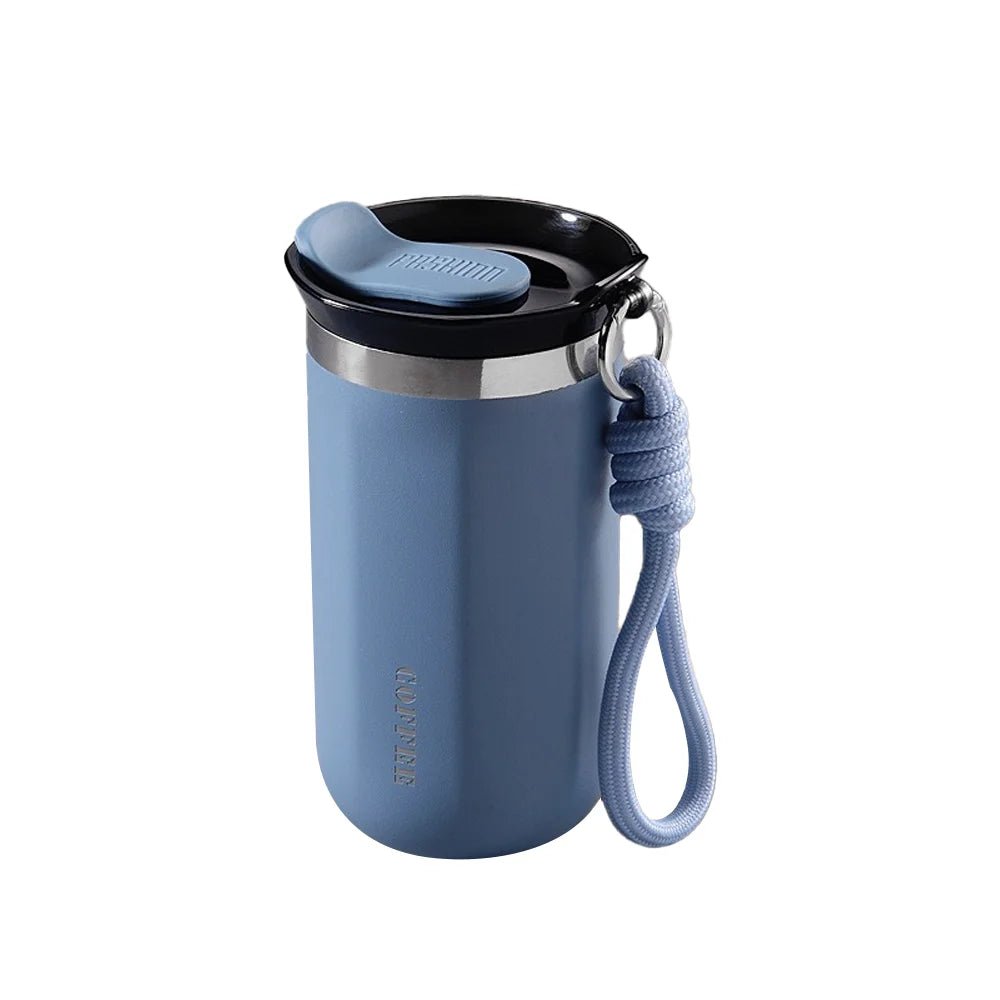 Blue tumbler with a black lid and rope handle on a white background