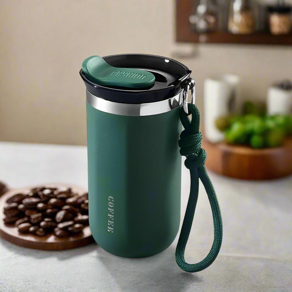 Green tumbler with a handle on a kitchen counter