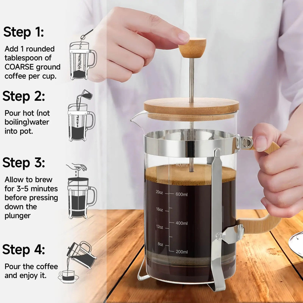 French press coffee maker with brewing steps displayed on a wooden surface