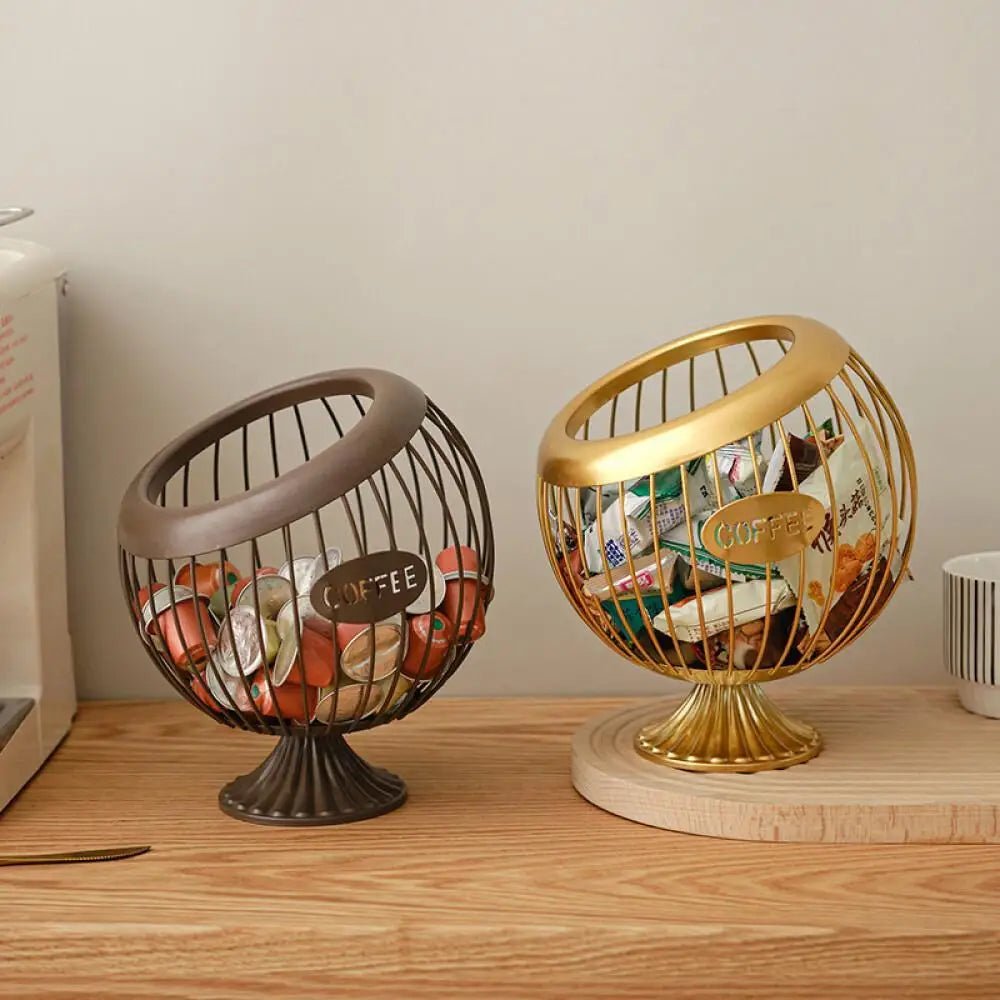 Two decorative baskets, one gold and one bronze, on a wooden surface.