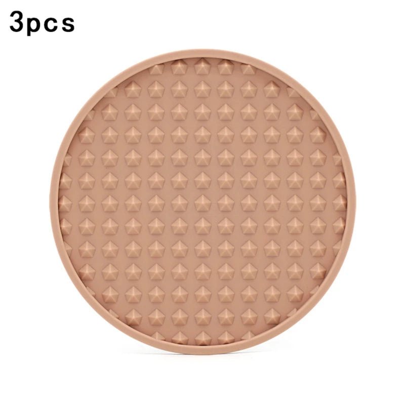 pink silicone coaster on a white background