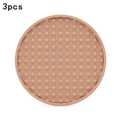 pink silicone coaster on a white background