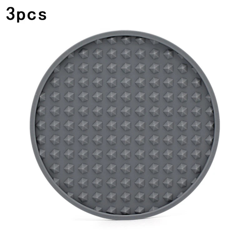 grey silicone coaster with different patterns on a white background