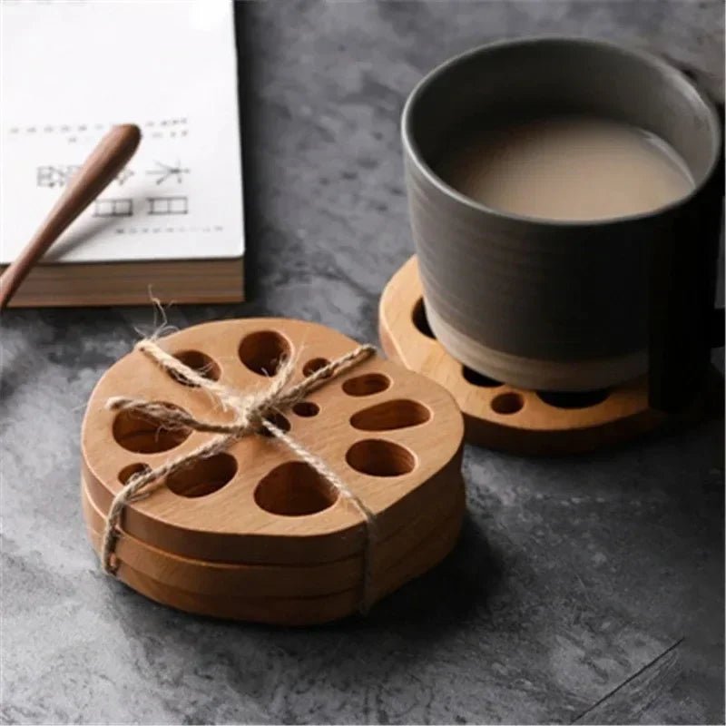 Set of wooden coasters with a cup of coffee on a gray surface