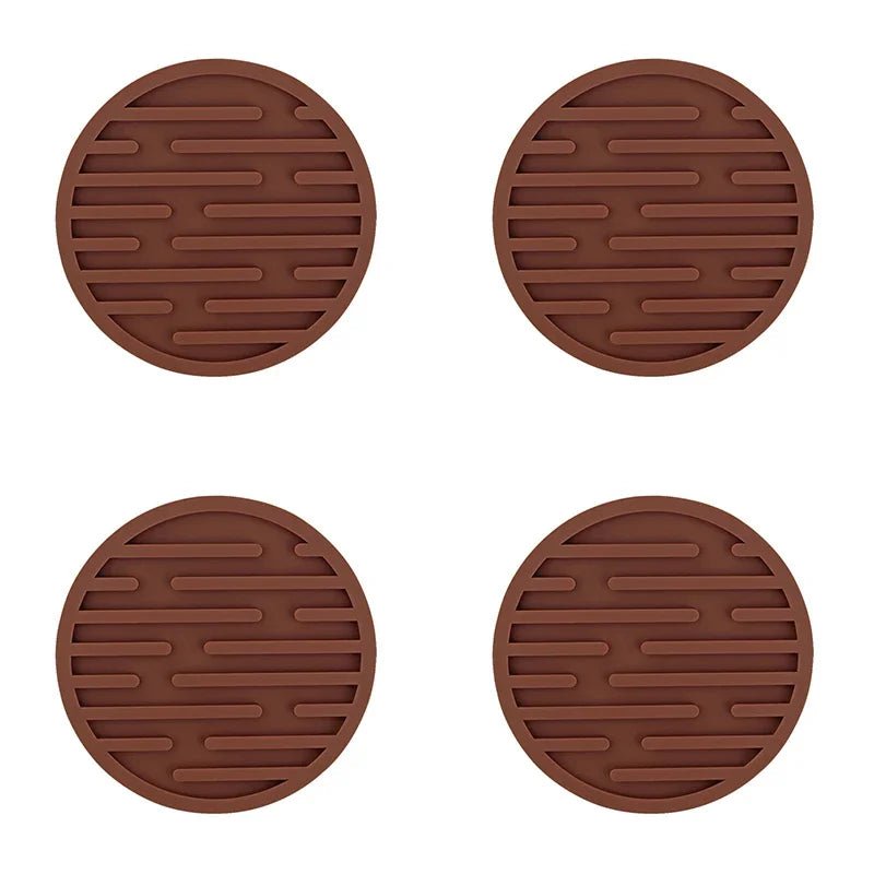 Four brown silicone coasters with textured surface on a white background