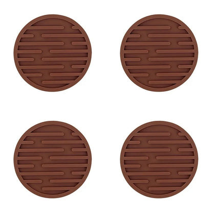 Four brown silicone coasters with textured surface on a white background