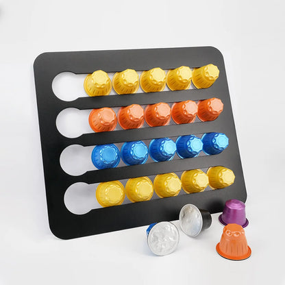 Colorful coffee capsules on a black tray against a white background