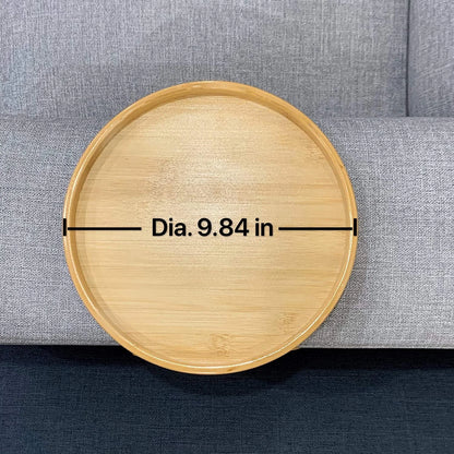 Wooden round tray with measurement label on a gray surface