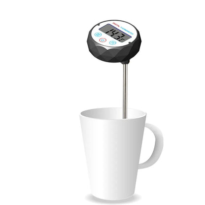 Digital thermometer inserted into a white mug on a white background