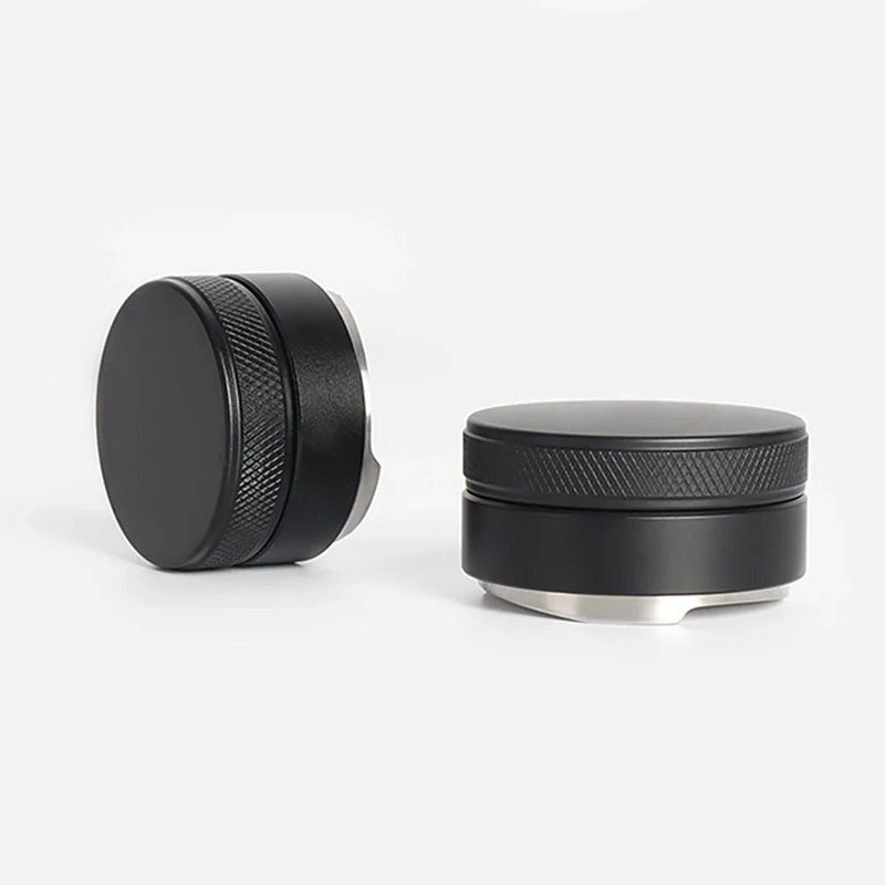 Two black metal coffee tamper on a white background