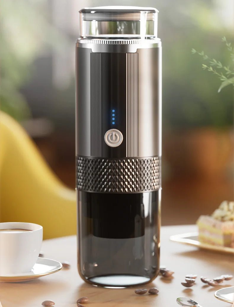 Black coffee maker on a table with a blurred background