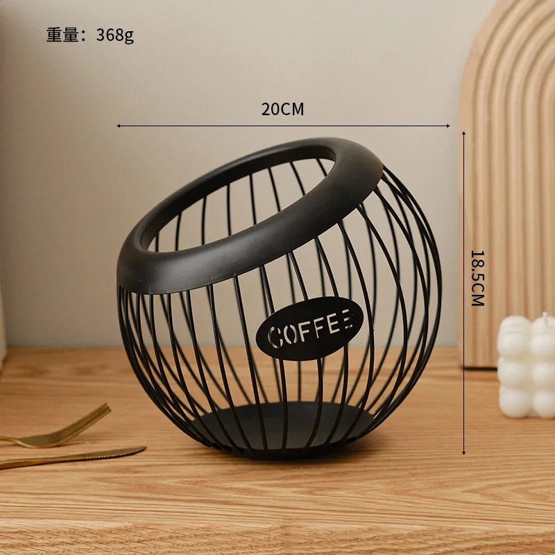 Black wire coffee basket with dimensions on a wooden surface