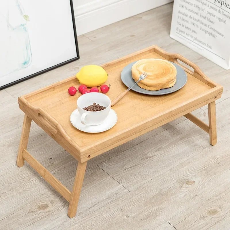 Wooden tray with food on a light wooden floor