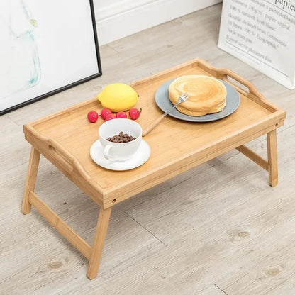 Wooden tray with food on a light wooden floor