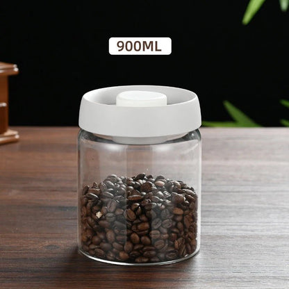 Glass jar with white lid filled with coffee beans on a wooden surface