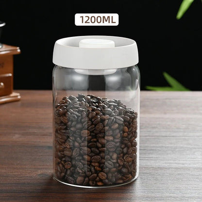 Clear jar with white lid filled with coffee beans on a wooden surface