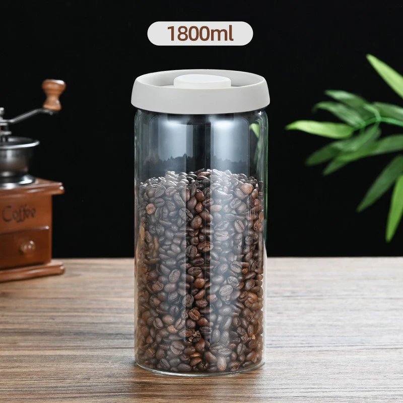 Container with coffee beans and a visible '1800ml' label on a wooden surface.