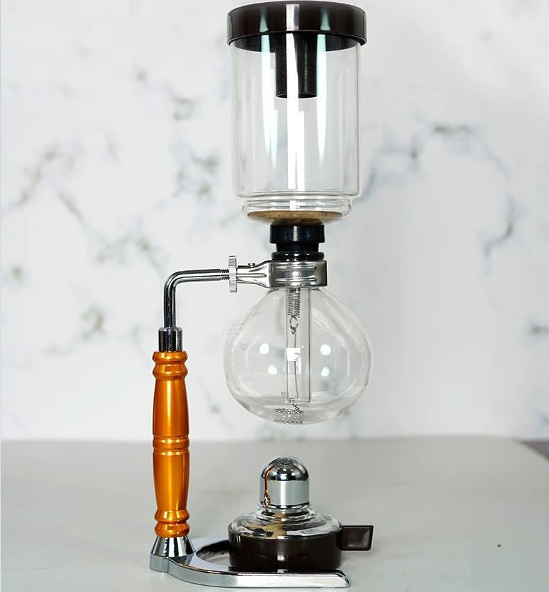Siphon coffee apparatus on a marble countertop
