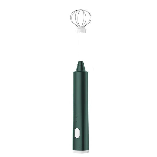 Green handheld milk frother with whisk attachment on a white background