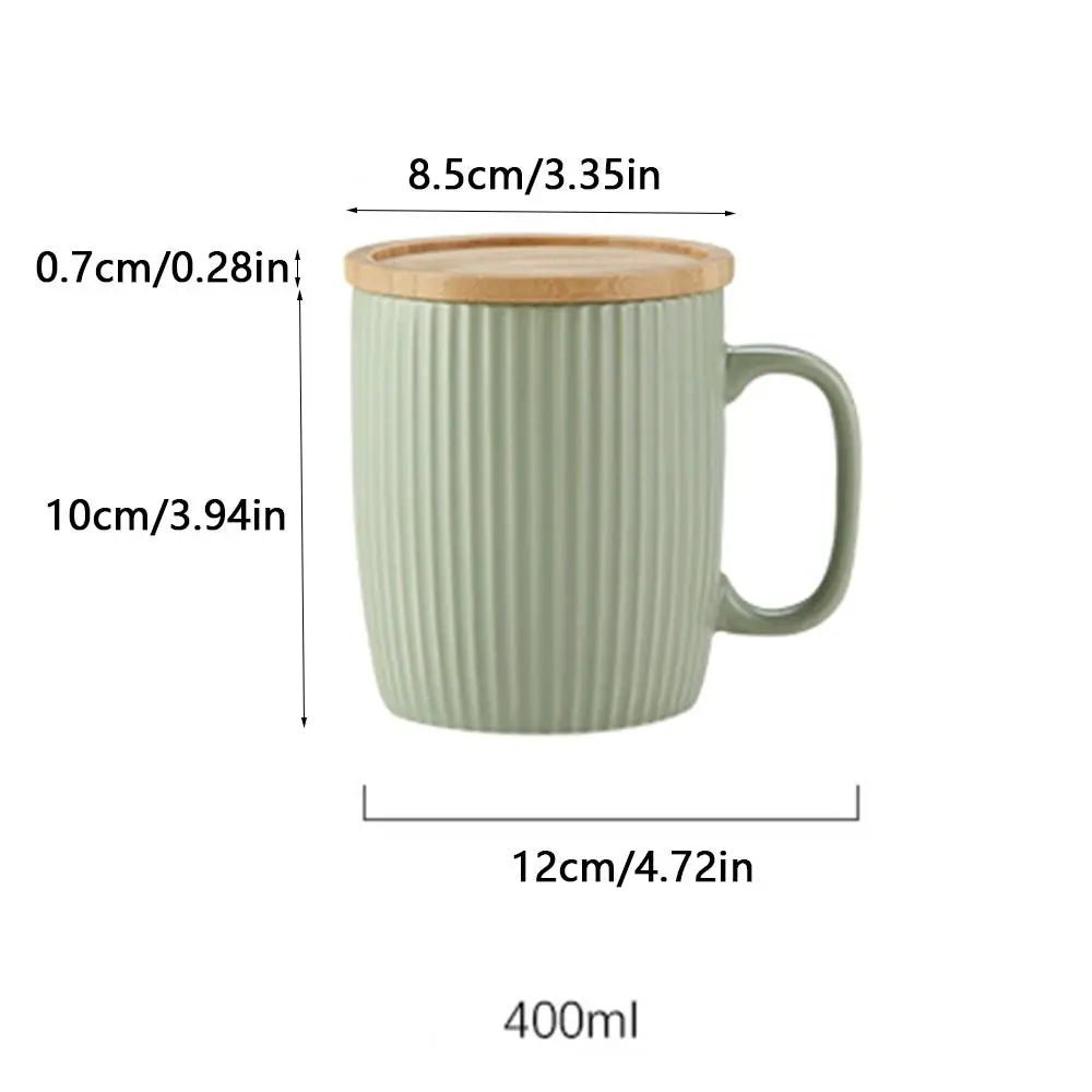 Green ceramic mug with wooden lid and measurements on a white background