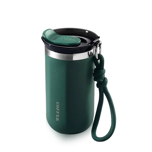 Green tumbler with a black lid and rope handle on a white background