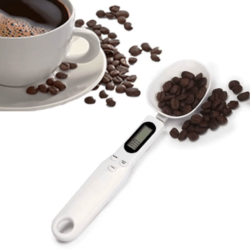 Digital measuring spoon with coffee beans and a cup of coffee on a white background