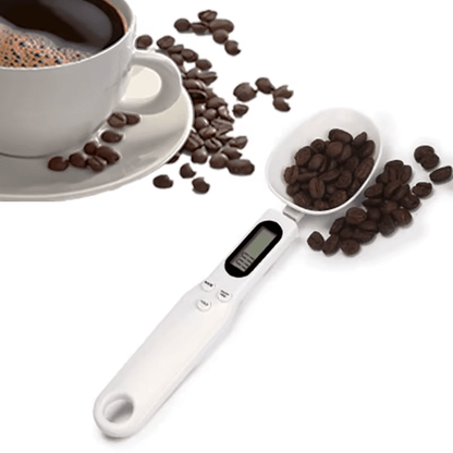 Digital measuring spoon with coffee beans and a cup of coffee on a white background