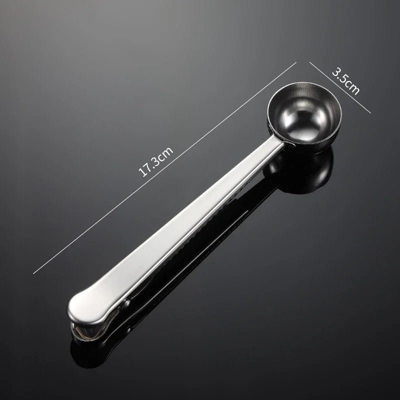 Metal measuring spoon with measurements on a dark background
