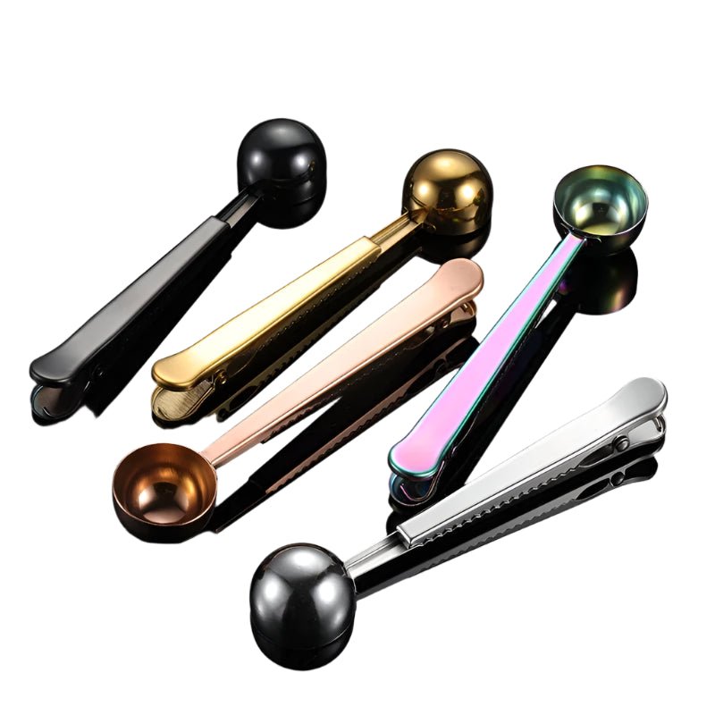 Set of six measuring spoons in different colors on a white background