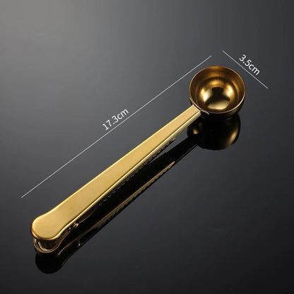 Gold measuring spoon with measurements on a black background