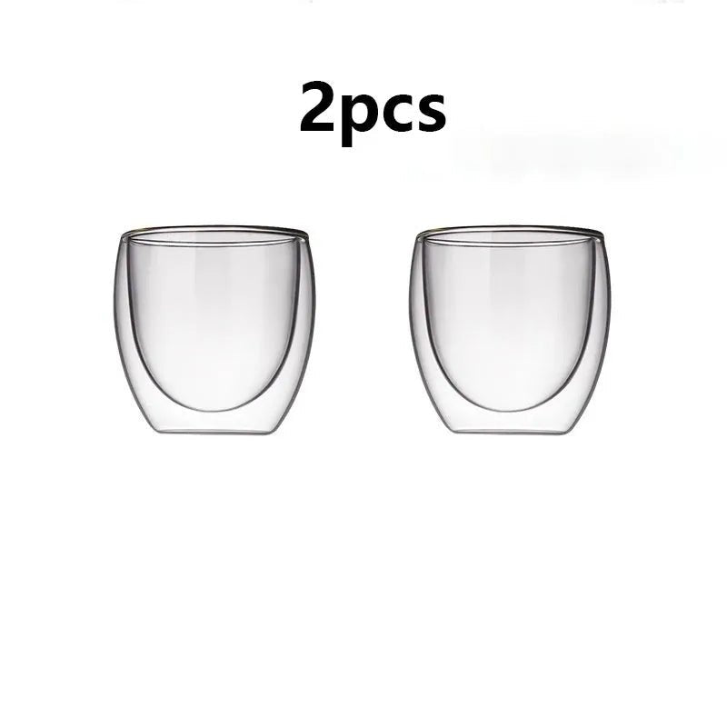 Two clear glass double-walled cups on a white background