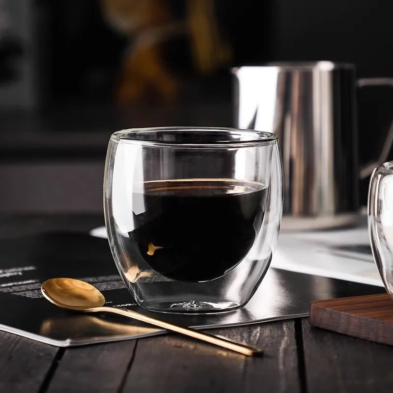 Clear glass cup on a wooden surface with a blurred background