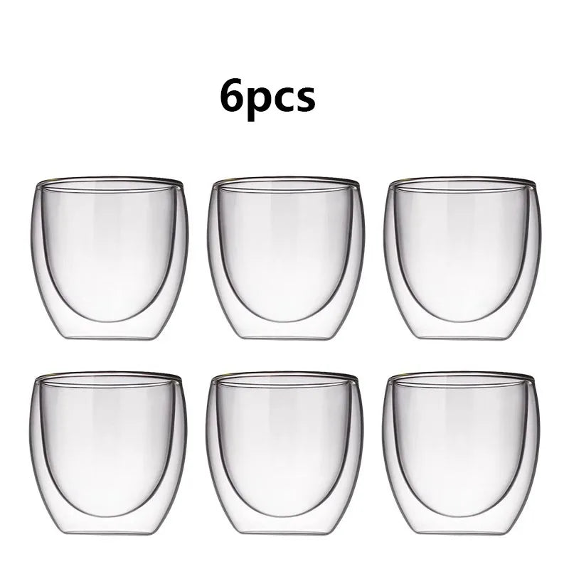 Set of six clear double-walled glass tumblers on a white background