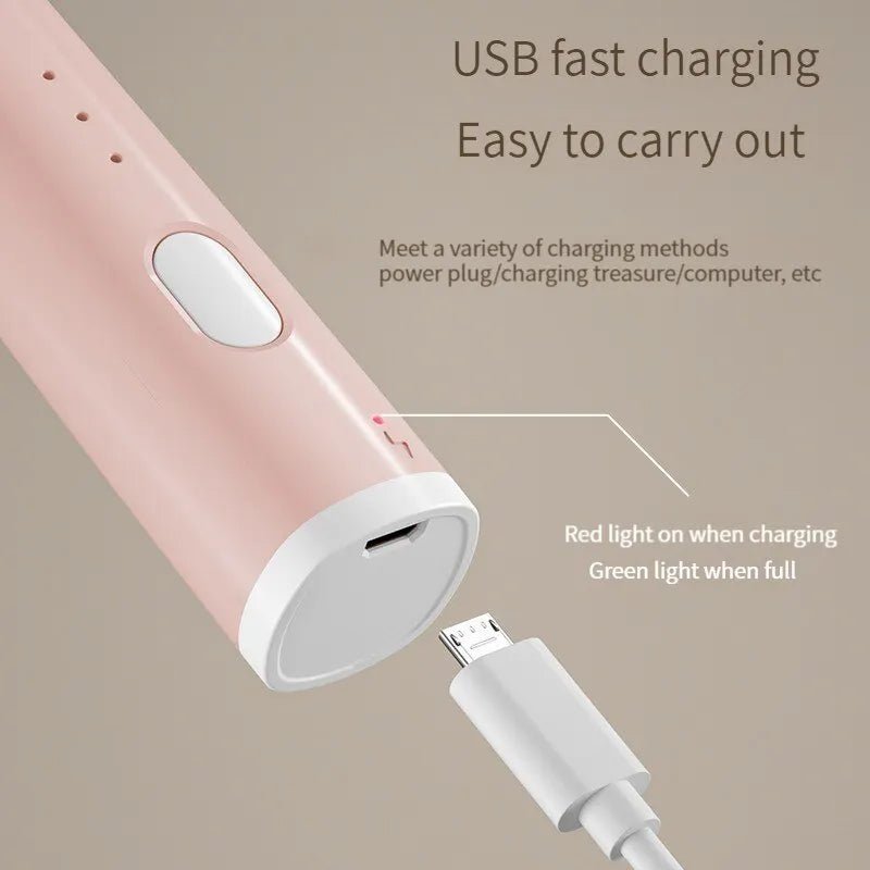 Pink USB power bank with charging cable on a beige background