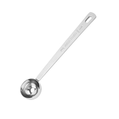 Stainless steel measuring spoon on a white background