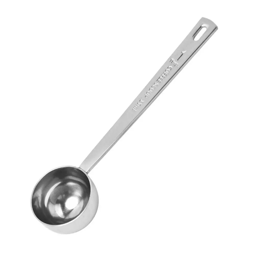 Stainless steel measuring spoon on a white background