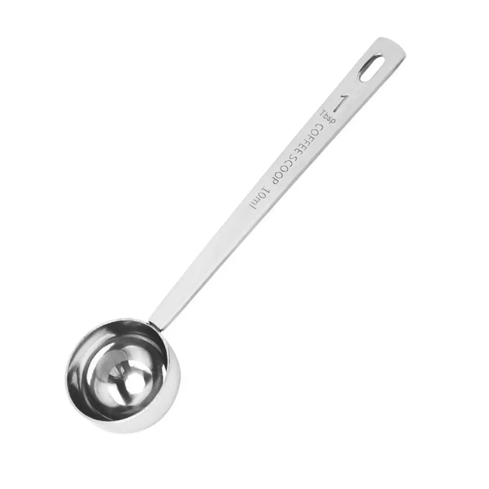 Metal measuring scoop on a white background
