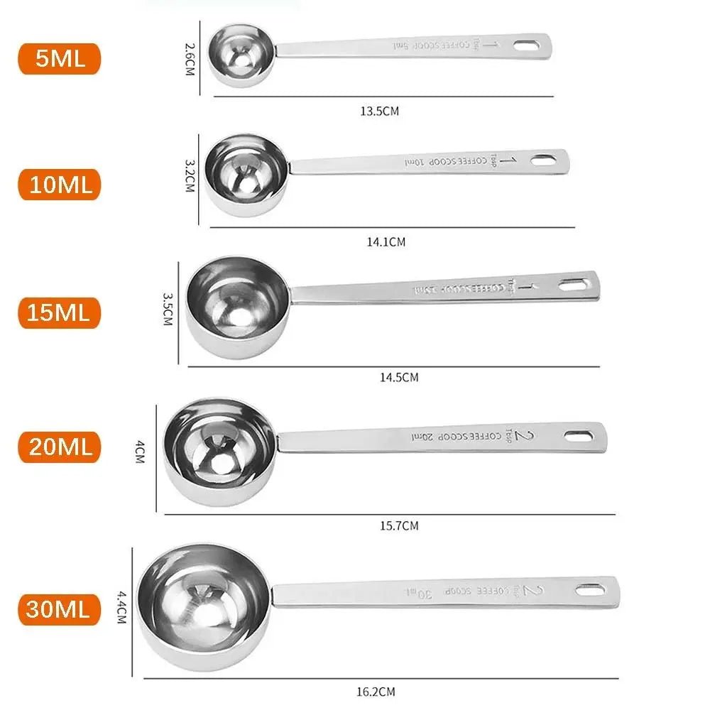 Set of stainless steel measuring spoons with measurements on a white background