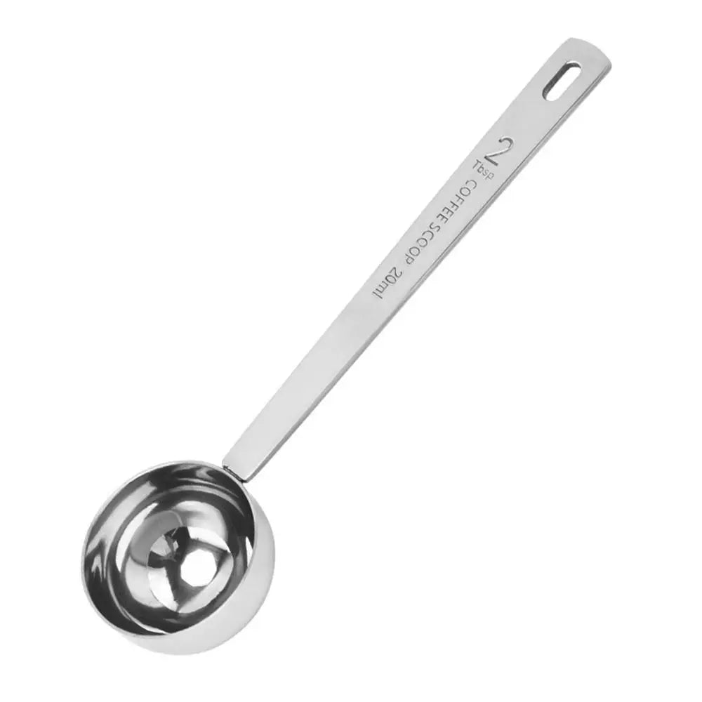 Stainless steel coffee scoop on a white background