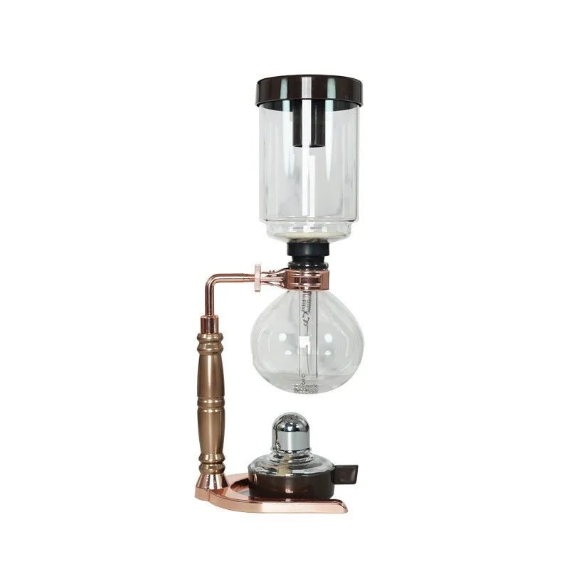 Vintage-style coffee maker with glass carafe and brass accents on a white background
