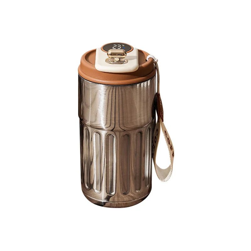 Silvery tumbler with brown lid and handle on a white background