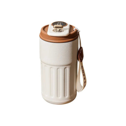 White tumbler  with brown lid and handle on a white background