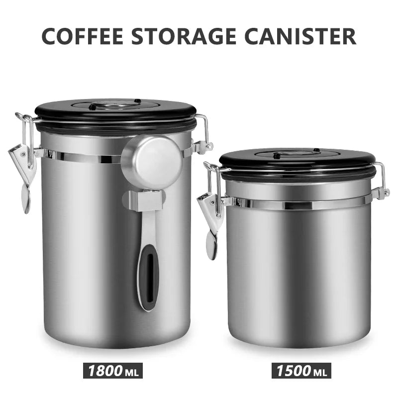 Two stainless steel coffee storage canisters with black lids on a white background.