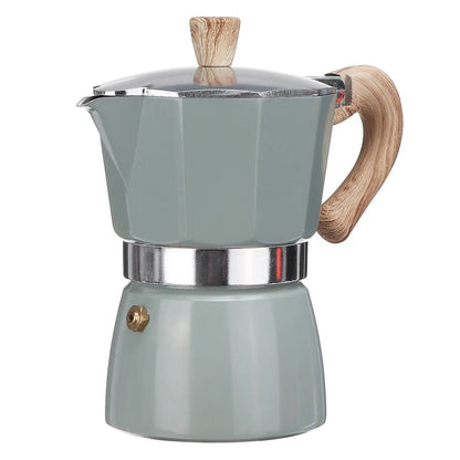 Green espresso maker with wooden handle and lid on a white background
