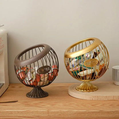 Two decorative baskets, one gold and one bronze, on a wooden surface.