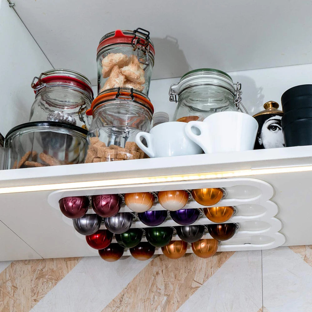 Colorful coffee pods on a white shelf with jars and cups in the background