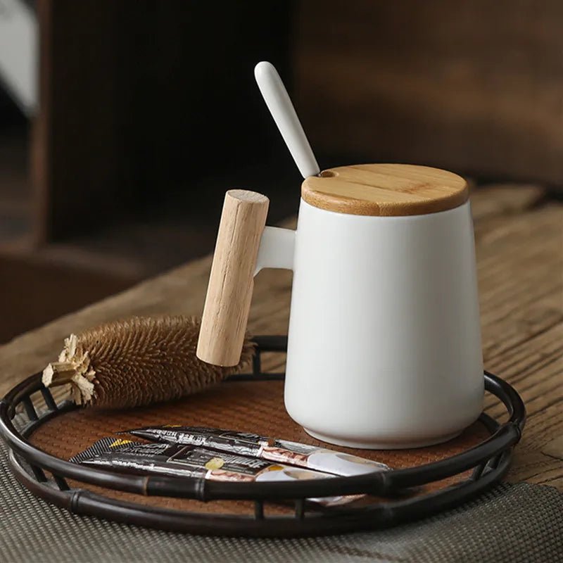 White mug with wooden handle and lid on a wooden tray